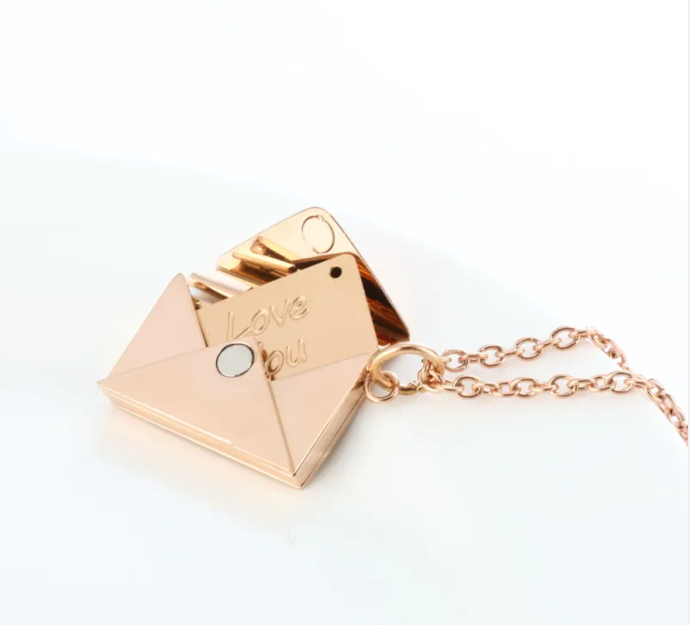 Rose gold envelope locket necklace open, Love You engraved on the flap