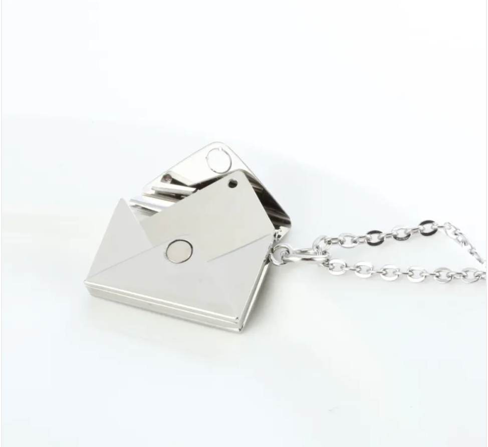 Steel envelope locket necklace open, showing the hinged flap