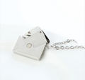 Steel envelope locket necklace with Love You engraved on the flap